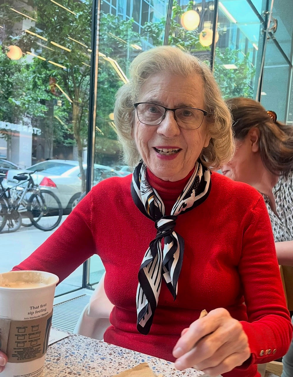 Women's silk scarf tied around her neck