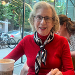 Women's silk scarf tied around her neck
